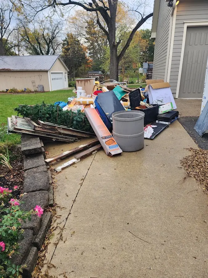 Dumpster being loaded with debris for 3 Yard Dumpster Rental in San Juan